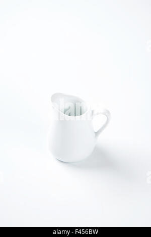 white milk jug on white background Stock Photo