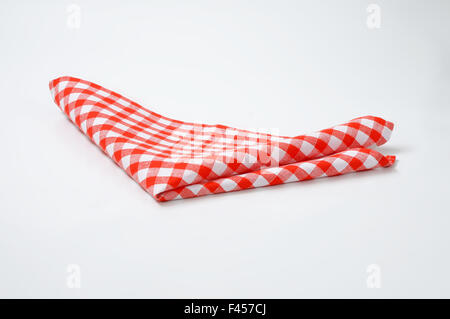 red and white checkered napkin on white background Stock Photo