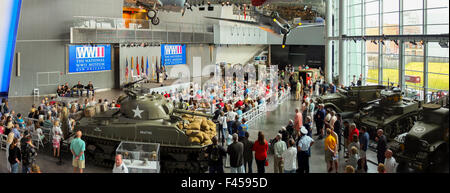 Surrounded by historical weapons, a crowd gathers for a Memorial Day observance at the Nation World War II Museum in New Orleans. Stock Photo