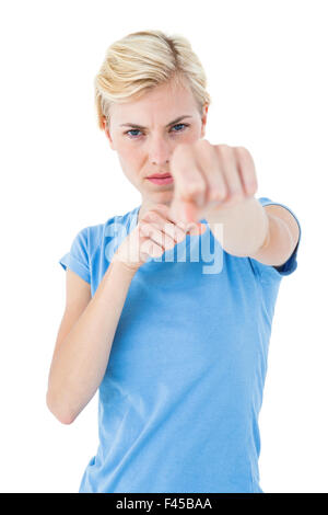 Stern blonde woman pointing with her finger Stock Photo