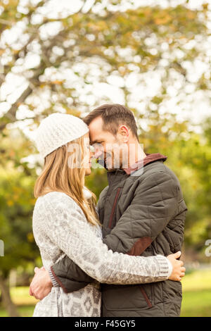 Portrait of smiling young couple embracing Stock Photo