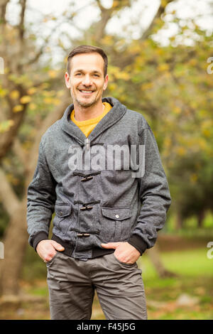 Young handsome man posing in park Stock Photo