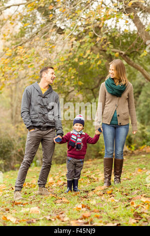 Smiling young couple with little boy laughing Stock Photo