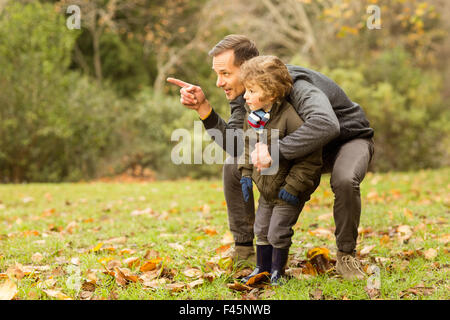 Father showing something to his son Stock Photo