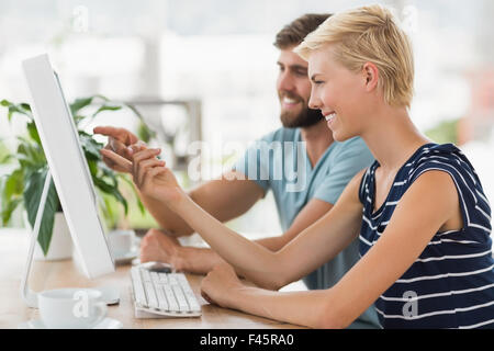 Creative business people working together on computer Stock Photo