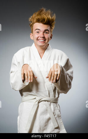 Funny karate fighter wearing white kimono Stock Photo - Alamy