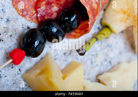 mix cold cut on a stone with fresh pears Stock Photo
