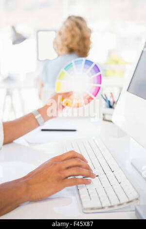 Young businessman typing on a computer Stock Photo