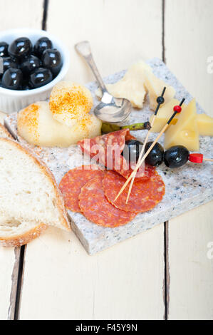 mix cold cut on a stone with fresh pears Stock Photo