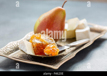 Honey, pear and brie cheese. Stock Photo