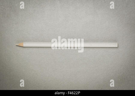 white pencil on gray paper Stock Photo