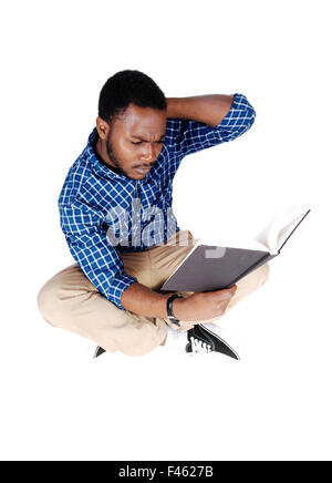 Black man sitting on floor. Stock Photo