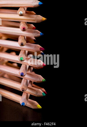 creatively stacked color pencils Stock Photo