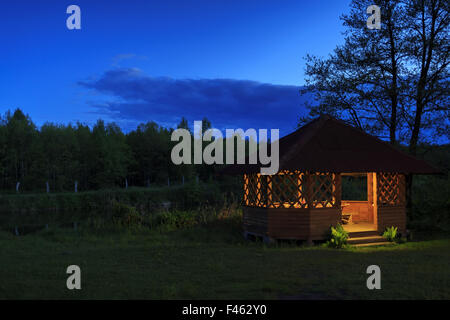 A gazebo on the bank of a river Stock Photo - Alamy
