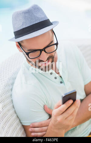 Happy handsome man using smartphone Stock Photo