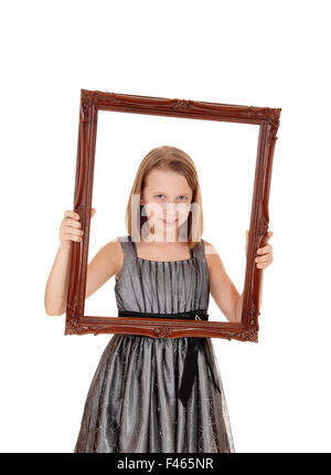 Pretty girl holding picture frame. Stock Photo