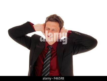 Man covering his ear's. Stock Photo