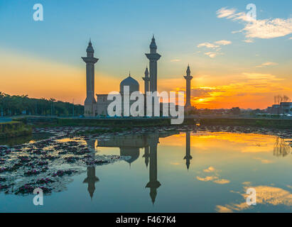 The Tengku Ampuan Jemaah Mosque, Bukit Jelutong, Malaysia mosque silhouetted at sunrise. Stock Photo