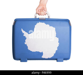 Used plastic suitcase with stains and scratches, printed with flag - Antarctica Stock Photo