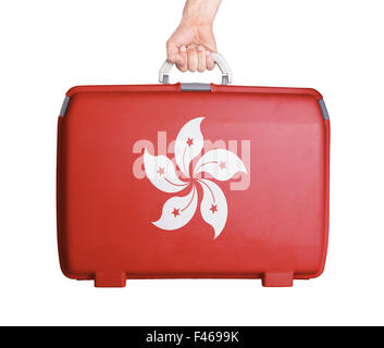 Used plastic suitcase with stains and scratches, printed with flag - Hong Kong Stock Photo