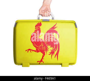 Used plastic suitcase with stains and scratches, printed with flag - Wallonia Stock Photo