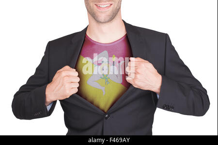 Businessman opening suit to reveal shirt with flag, Sicily Stock Photo