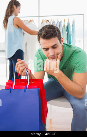 Woman doing shopping at store with boyfriend Stock Photo