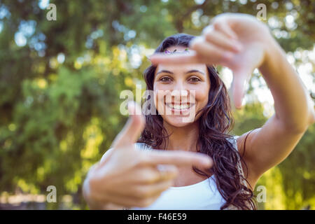 Pretty brunette framing with hands Stock Photo