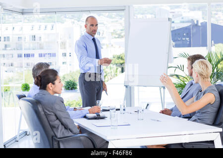 Businesswoman asking question during meeting Stock Photo