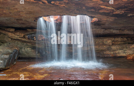 A tributary of the Gifberg River falls through a hole in the sandstone formation at the Gifberg (Poison Mountain) Resort Stock Photo