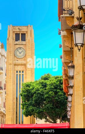 A view of the clock tower in Nejme Square in Beirut, Lebanon and some local architecture. A landmark of the beautiful and pictur Stock Photo