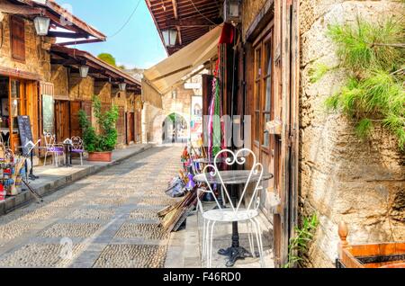 A view of the old pedestrian souk in Byblos, Lebanon during the day. A very medieval and picturesque area,  paved with little st Stock Photo