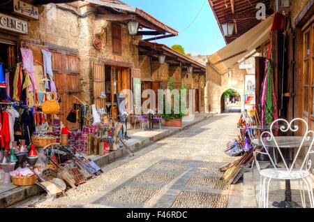 A view of the old pedestrian souk in Byblos, Lebanon during the day. A very medieval and picturesque area,  paved with little st Stock Photo