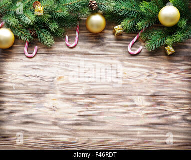 Christmas decoration with fur and baubles on old wood. Stock Photo