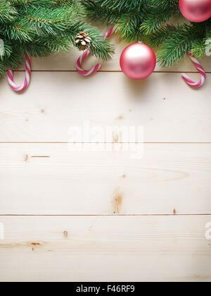 Christmas decoration with fur and baubles on old wood. Stock Photo