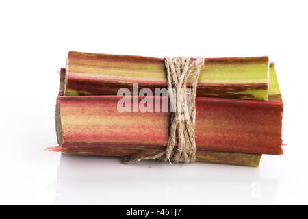 Bunch of fresh rhubarb isolated on white background Stock Photo