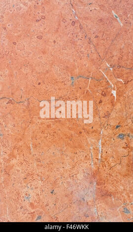 Red marble tile surface with patina, organic texture background copy space. Stock Photo