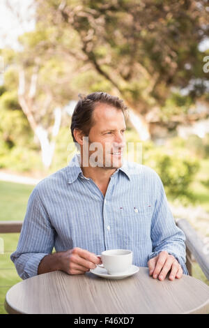 Man drinking coffee outdoors Stock Photo