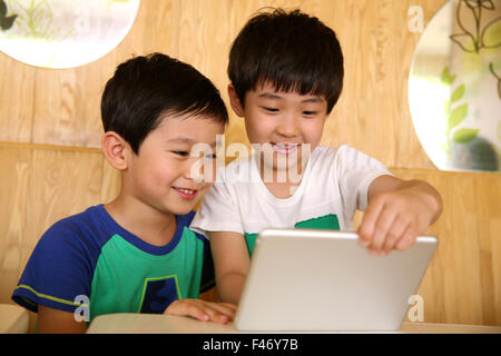 Two boys using digital tablet Stock Photo