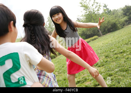 Children playing games in field Stock Photo