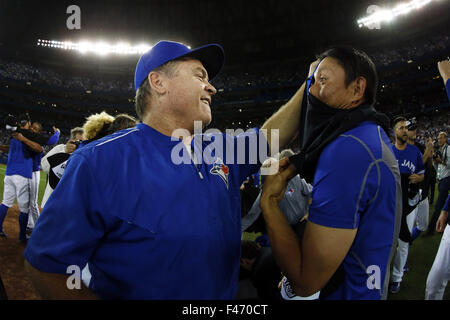 (L-R) John Gibbons, Munenori Kawasaki (Blue Jays), OCTOBER 14, 2015 - MLB : Munenori Kawasaki (R) of Totonto Blue Jays celebrates with manager John Gibbons (L) for the victory against the Texas Rangers during in Game 5 of baseball's American League Division Series at Rogers Centre in Toronto. (Photo by AFLO) Stock Photo