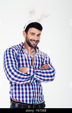 Portrait of a happy man in bunny ears looking at camera isolated on a white background Stock Photo