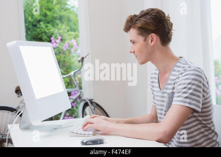 Serious handsome man working on computer Stock Photo