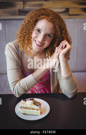 Happy pretty brunette smiling at camera Stock Photo