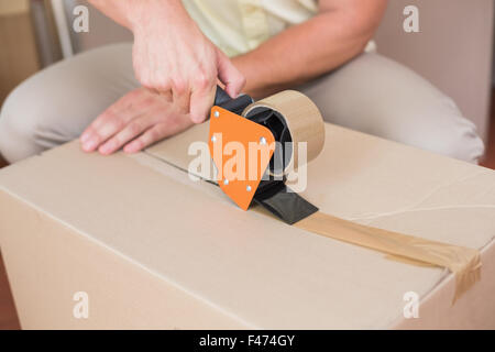 Handsome man packing box Stock Photo