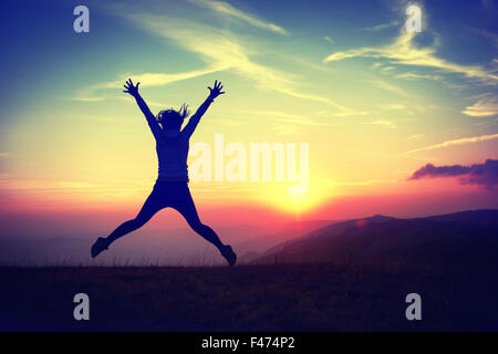 Young woman at sunset Stock Photo