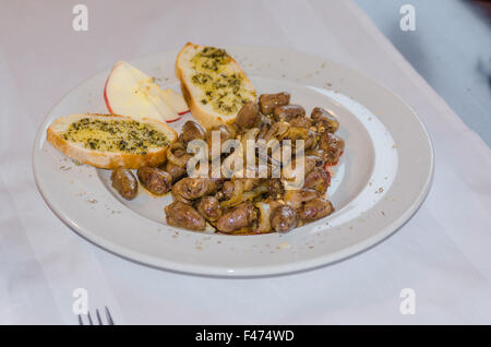 Chicken hearts with garlic bread Stock Photo