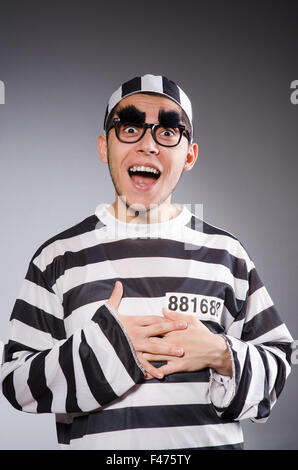 Funny prisoner isolated on gray Stock Photo