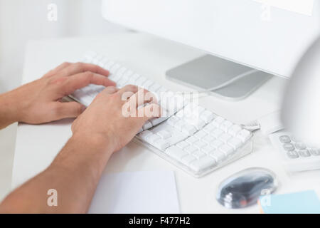 Man typing on computer keyboard Stock Photo