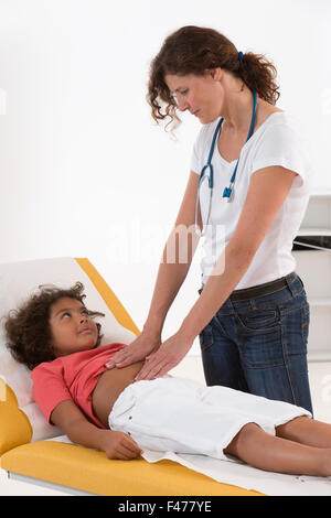 ABDOMEN PALPATION, CHILD Stock Photo